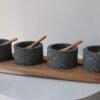 Volcanic stone condiment set with wooden tray