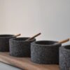 Volcanic stone condiment set with wooden tray