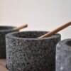 Volcanic stone condiment set with wooden tray