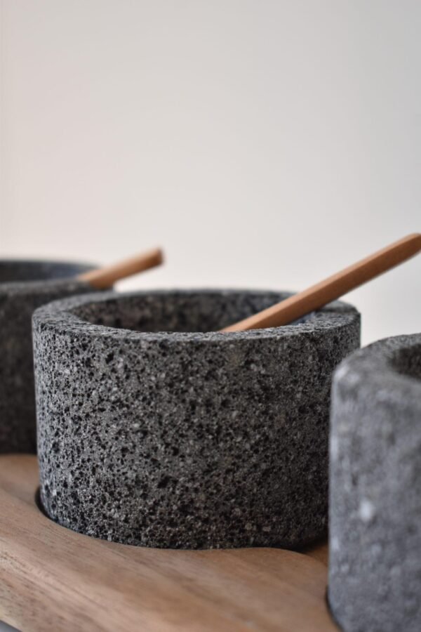 Volcanic stone condiment set with wooden tray
